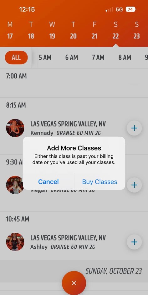 How do I book Orangetheory classes at another studio through the app