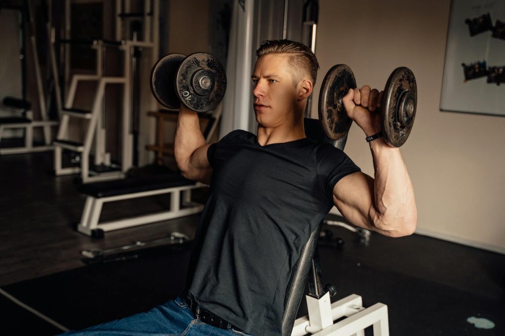 Dumbbell Overhead Press: Benefits, Form & Mistakes to Avoid