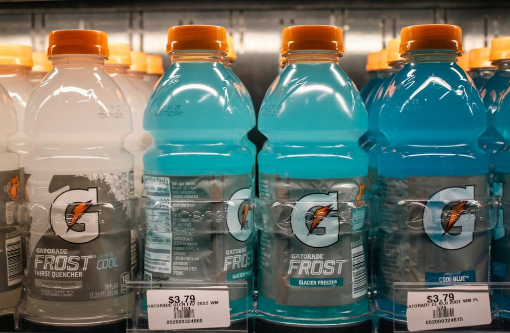 Gatorade frost bottles are displayed in a store. Electrolyte Drinks and Sports Beverages