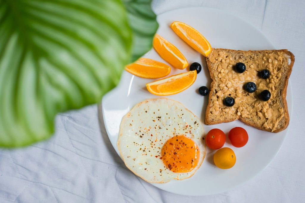 sliced bread with sliced lemon on white ceramic plate
